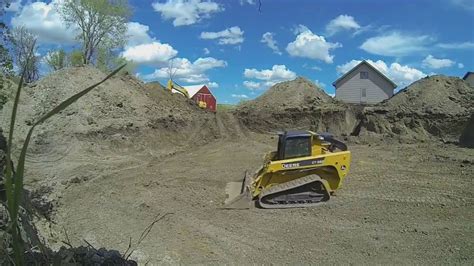 grading clay with skid steer|skid steer grading.